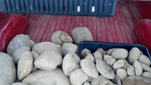 A load of river rock in the bed of my pickup.